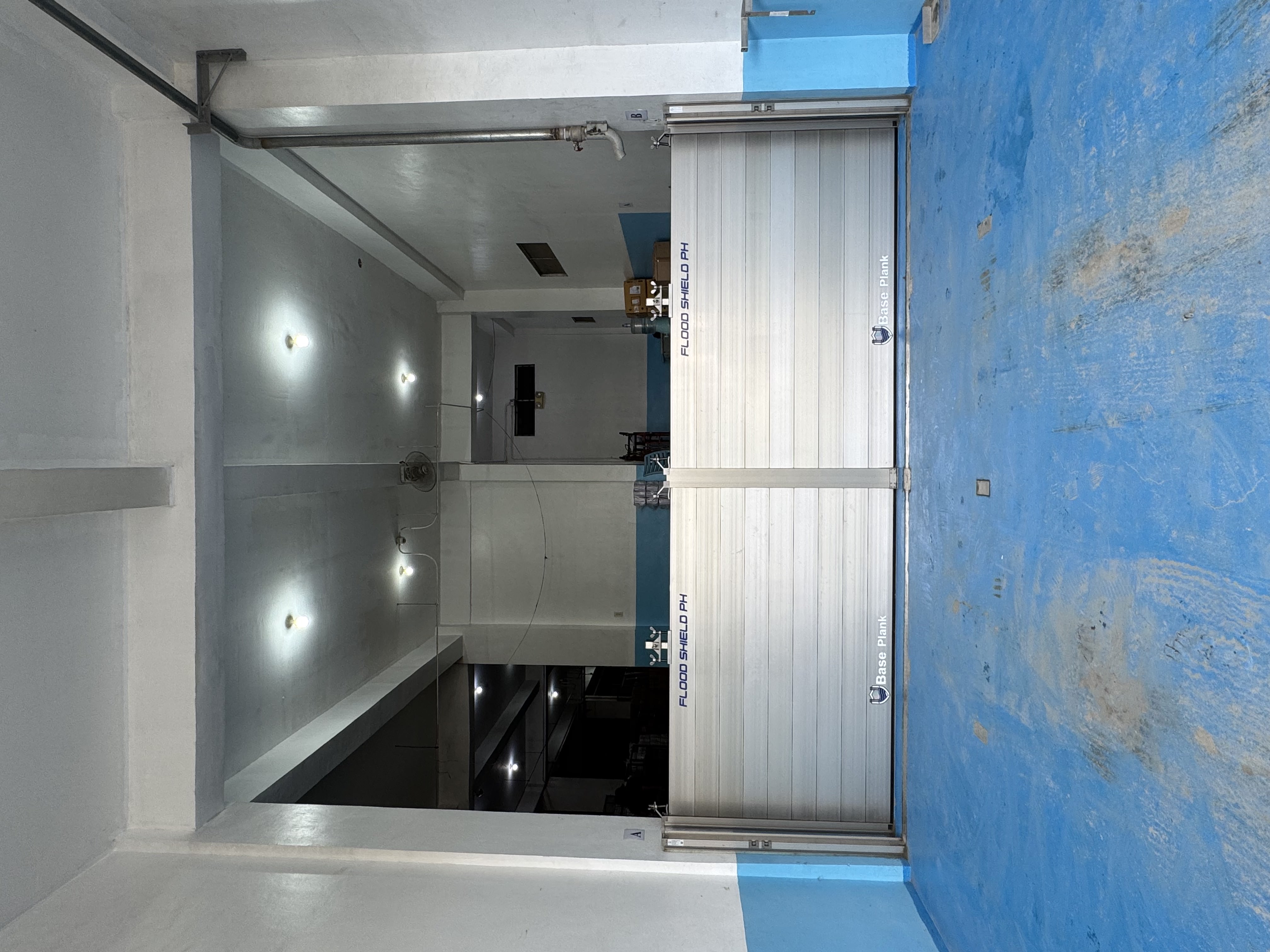 Industrial flood barrier protecting a warehouse facility in the Philippines.